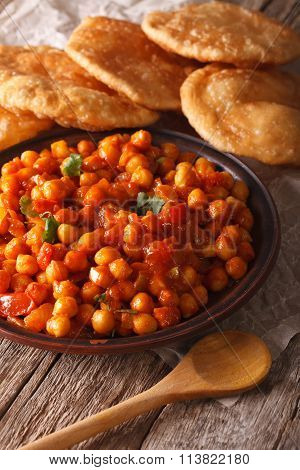 Indian Cuisine: Chana Masala And Puri Bread Close-up. Vertical