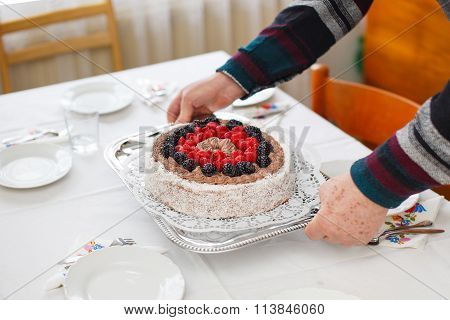 Senior Man Serving Cake