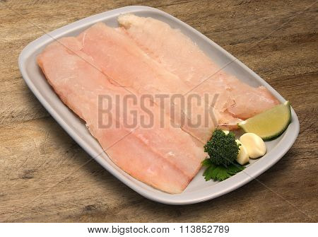 Raw Fish On Wooden Background.