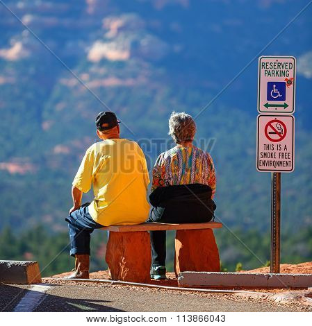 Elderly couple enjoying with beautiful Sedona's red rocks view.