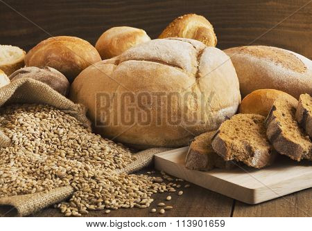 Bread And Grains Scattered On The Wooden Table