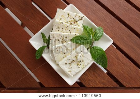 Greek Feta Cheese On Wooden Table
