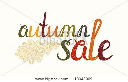 Autumn sale inscription with oak leaf.