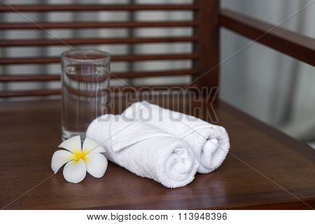 Spa Composition Wipes A Glass Of Water And Flowers