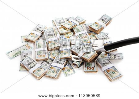 Shovel lifts dollar bills on white background