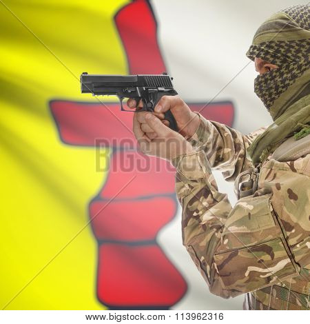 Male In With Gun In Hand And Canadian Province Flag On Background - Nunavut