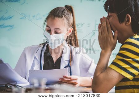Female doctor explaining diagnosis to her patient. Young pretty future doctor on classes learning how to treat a patient