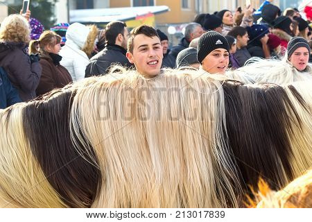 Razlog, Bulgaria - January 14, 2017: People in traditional carnival kuker costumes at Kukeri festival Starchevata