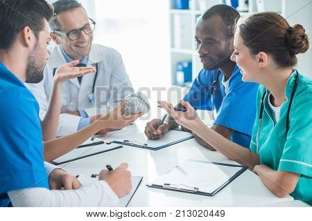 Team Of Doctors Having Conversation