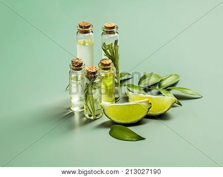 The lime oil on green studio background on table