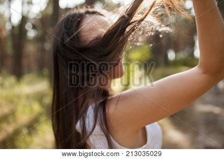 Pretty sunny stranger woman forest happiness concept. Unity with nature.