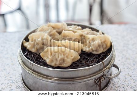 Traditional Chinese steamed jiaozi dumplings in a Beijing restaurant