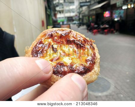 Holding a Macanese Egg Tart Macau China