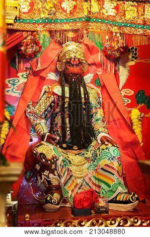 SAI KUNG, HONG KONG - SEPT 29, 2013 - Statue of popular Chinese god Guan Yu inside Tin Hau Temple, Sai Kung, Hong Kong