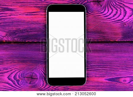 Mobile phone with blank screen mock up isolated on pink wood table background. Smartphone on wood table. Smartfone white