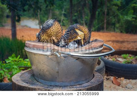 The durian is brought to burn on stove to add flavor. Eat hot durian with extra nutrients.