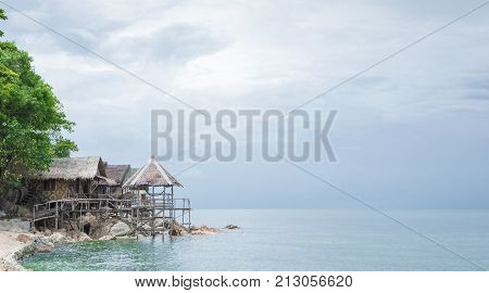 View of nice bungalow on  tropical empty sandy beach