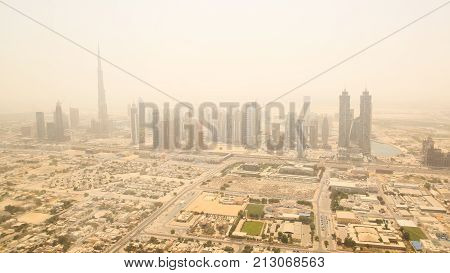 Aerial view of the business district of Dubai. Shooting in the summer haze of heat. August 2014