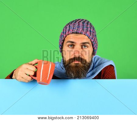 Fall Season And Influenza. Man With Beard Holds Orange Cu