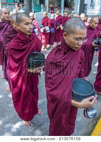AMARAPURA MYANMAR - SEP 03 : Monks at the Mahagandayon Monastery in Amarapura Myanmaron September 03 2017 Mahagandayon Monastery has 2000 monks at any given time.