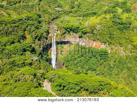 Aerial view of famous Chamarel Waterfall in the tropical island of Mauritius in green jungle