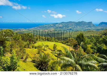 Aerial view of Mauritius island panoramic landscape with green hills coastline and mountain peaks