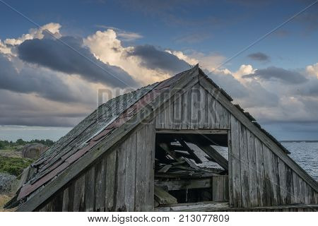 Abandoned houses in the Baltic Sea. Shore nature and ruins facilities architecture concept. Mohni small island in Estonia Europe.