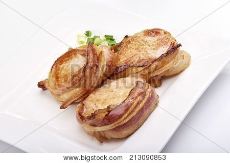 Pork Fillet Wrapped In Bacon, Isolated On White Background
