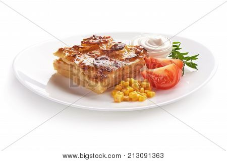 Potato casserole with vegetables, isolated on white background.