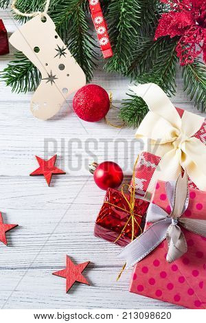beautiful christmas background with gift boxes balls christmas ornaments and christmas tree branches copy space