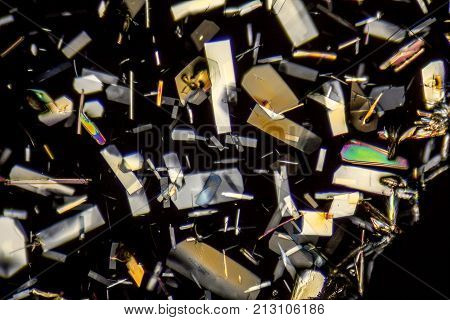 microscopic shot showing colorful microcrystals in polarised light