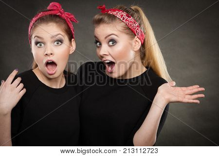 Craze fun and positive madness. Women showing their funny faces feel carefree. Girls in retro pin up fashion style present crazy behave.