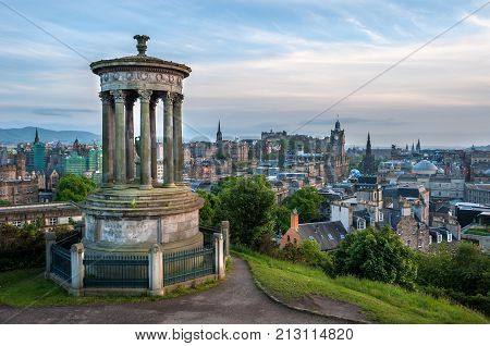 EDINBURGH, SCOTLAND - JUNE 18, 2016 - View of Edinburgh from Calton Hill with the Dugald Stewart Monument in the foreground