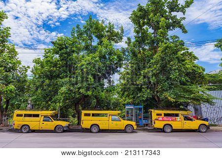 CHIANG MAI THAILAND - JULY 26: These are yellow taxis which are also used as buses to collect groups of people around the city on July 26 2017 in Chiang Mai