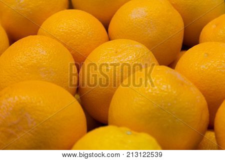Citrus fruit, close-up, big juicy oranges,orange background
