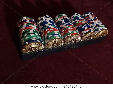 Bitcoi coins with poker chips on red cloth. The concept of replacing bitcoin with all payment methods.