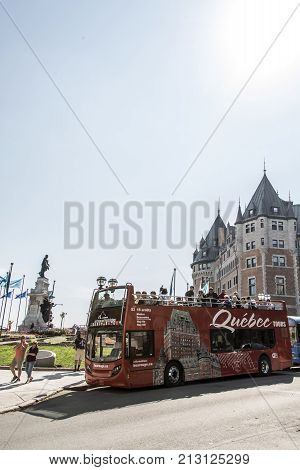Quebec city, Canada 13.09.2017 Red sightseeing double deck bus in front of Chateau Frontenac most famous tourist attraction UNESCO World Heritage Site city tours