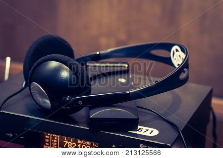 Wireless Multy Language Headphones Set On The Chairs In Conference Room