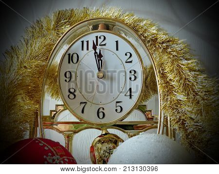 Time on the clock is approaching the New Year. Less than five minutes before the New Year. Celebratory background. New Year's and Christmas 