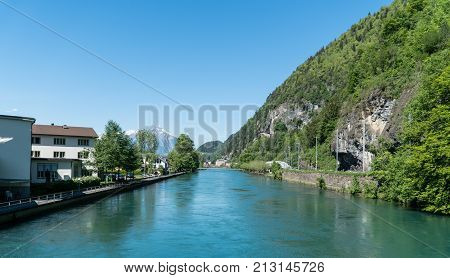 Interlaken Switzerland - May 2017: Scenery of fishing village Iseltwiald on Brienz lake in Interlaken Switzerland.