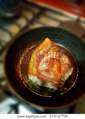 pork cooking on frying pan closeup photo
