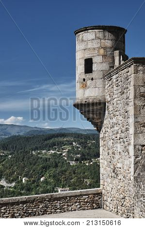 The stone turret and walls of the medieval castle of Aubenas in France