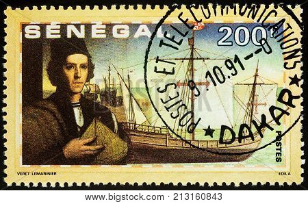 Moscow Russia - November 10 2017: A stamp printed in Senegal shows Christopher Columbus and ship 