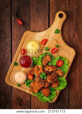 Chicken Nuggets And Sauce On A Wooden Background. Flay Lay. Top View