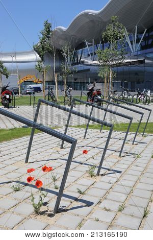 ZAGREB, CROATIA - MAY 19, 2017: Parking with poppies for bicycles and motorcycles in front of the airport in Zagreb