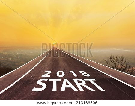 Text start and two thousand eight teen on long paveway road aboved blurred top city view along to golden sun rise for abstract background with copy space