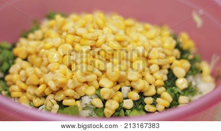 Fresh salad with canned corn cabbage and parsle