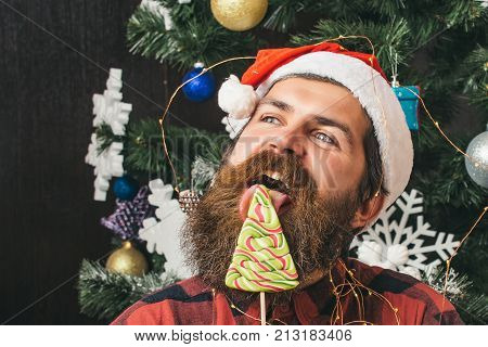Christmas Man With Beard On Happy Face And Lollipop.