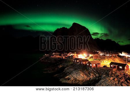 Northern lights over the vilage of Hamnoy Lofoten Norway