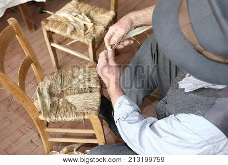 Hand Of An Expert Stuffing Chair At Work